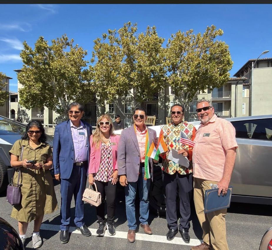 With neighbors at a community gathering